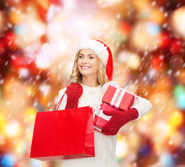 Woman in santa helper hat with shopping bags - Zdjęcie, obraz