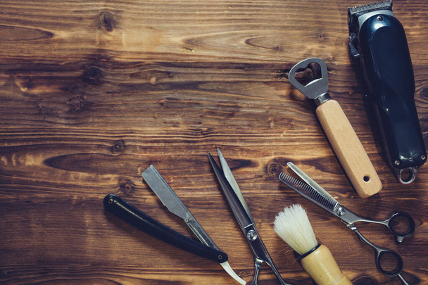 Old vintage barbershop tools on wooden table. - Fotoğraf, Görsel