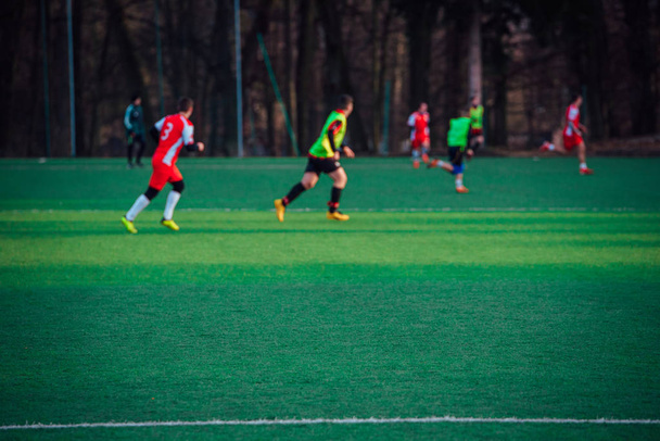 Football players on the green pitch, blurred background - Fotoğraf, Görsel