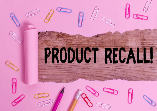 Text sign showing Product Recall. Conceptual photo process of retrieving potentially unsafe goods from consumers Stationary and torn cardboard placed above a wooden classic table backdrop. - Photo, Image