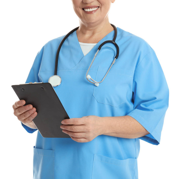 Mature doctor with clipboard on white background, closeup - Foto, immagini