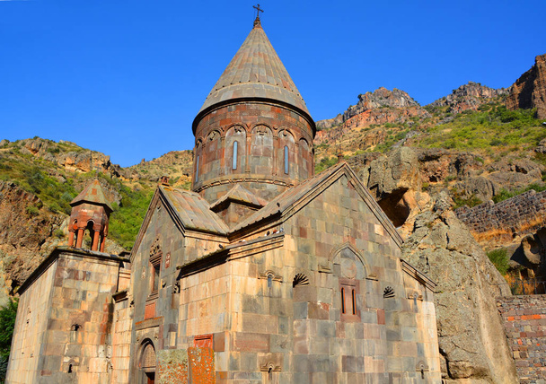 KOTAYK ARMENIA 09 15 19: Geghard is a medieval monastery in the Kotayk province of Armenia, carved out of the adjacent mountain. It is listed as a UNESCO World Heritage Site. - Photo, Image