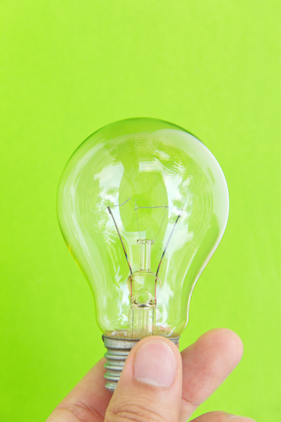 hand met eco lamp energieconcept - Foto, afbeelding