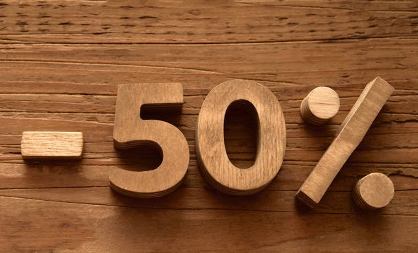 minus 50 Fifty percent sale on wood board. empty copy space for inscription. Black Friday idea.  - 写真・画像