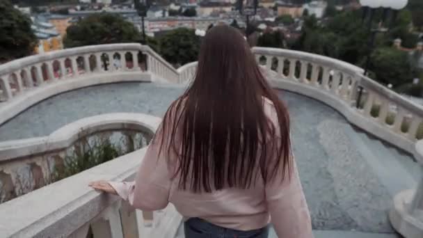 Active girl takes a minute to enjoy Melk view. Wachau Valley in Austria - Footage, Video