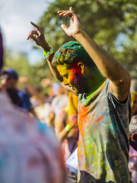 Montreal, Canada - August 10, 2019: People celebrate HOLI Festival throwing color powders in Horloge Park in Montreal - Photo, image