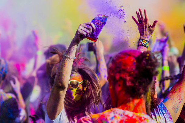 Montreal, Canada - August 10, 2019: People celebrate HOLI Festival throwing color powders in Horloge Park in Montreal - Фото, зображення