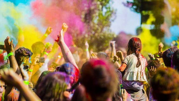 Montreal, Canada - August 10, 2019: People celebrate HOLI Festival throwing color powders in Horloge Park in Montreal - Photo, Image