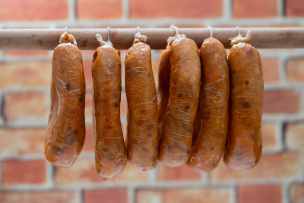 portuguese smoked sausages alheira on wooden stick - Foto, afbeelding