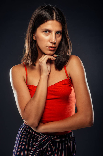 Body shot of a trendy young woman wearing modern style clothes - Fotografie, Obrázek
