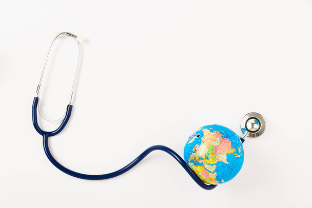 World health day concept, Stethoscope and globe on white backgro - Photo, image
