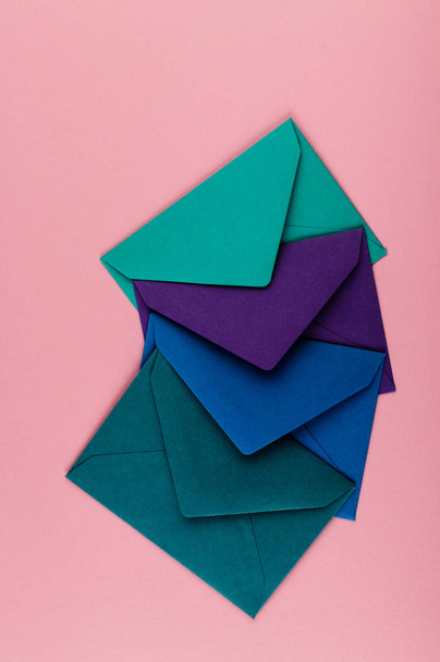 Colorful envelopes on a pink background. - Photo, Image