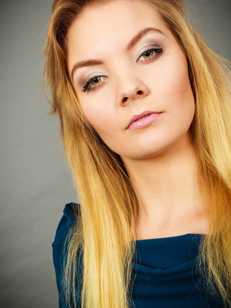 Portrait blonde young woman having serious face expression - Fotografie, Obrázek