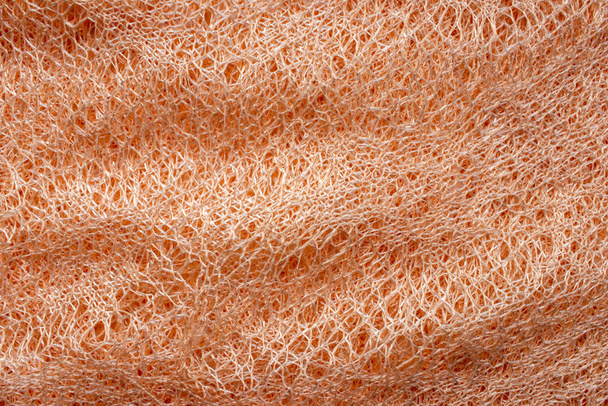 Mesh Fabric.Orange Mesh Textur. leichter Arbeitshintergrund. - Foto, Bild