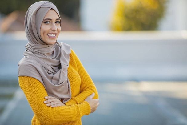 Muslim woman wearing hijab with a happy face standing and smiling with a confident smile showing teeth. Muslim women with smiling face. Beautiful middle eastern woman wearing abaya - Valokuva, kuva