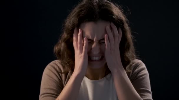 Video of a young woman close-up screaming on black background. Mental illness concept. - Filmmaterial, Video