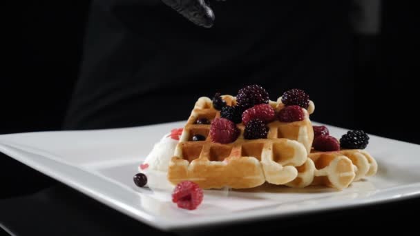 Delicious holiday wafers with raspberries and blueberries served on white plate. Slow motion food video. Freshly baked food, lined with blueberries and ice-cream, juicy berries for breakfast. Food - Video, Çekim