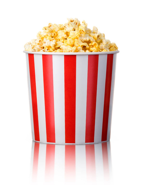 Paper striped bucket with popcorn isolated on white background - Φωτογραφία, εικόνα