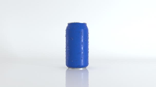 Abstract realistic 3D blue can with water drops on surface. Rotating soda or beer can rotating on white glass surface. Seamless loop. - Footage, Video