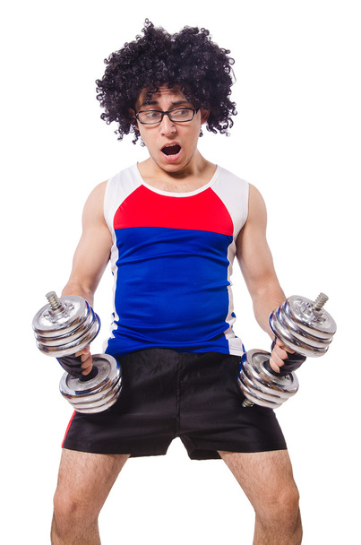 Funny man exercising with dumbbells - Фото, изображение