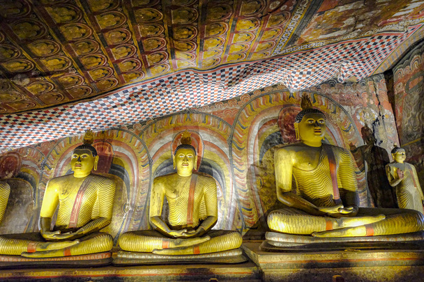Dambulla, Sri Lanka - February 2020: Buddha statue inside Dambulla cave temple on February 8, 2020 in Dambulla, Sri Lanka. Cave III Maha Alut Viharaya. Major attractions are spread over 5 caves, which contain statues and paintings. - Foto, Bild