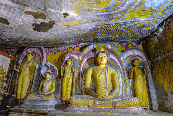 Dambulla, Sri Lanka - February 2020: Buddha statue inside Dambulla cave temple on February 8, 2020 in Dambulla, Sri Lanka. Cave IV Pachima Viharaya. Major attractions are spread over 5 caves, which contain statues and paintings. - Foto, Imagen