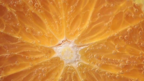 juicy ripe orange fruit close-up. orange in water under water. fruit for juice - Materiał filmowy, wideo