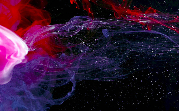 Watercolor futuristic ink in water on a black background. Cosmic - Fotó, kép