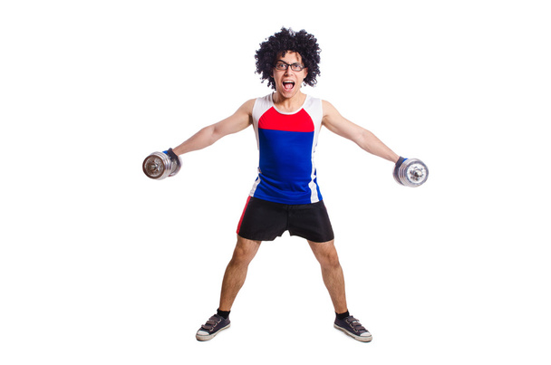 Hombre divertido haciendo ejercicio con pesas - Foto, Imagen
