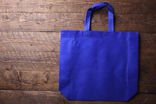 textilní taška na dřevěném pozadí - Fotografie, Obrázek