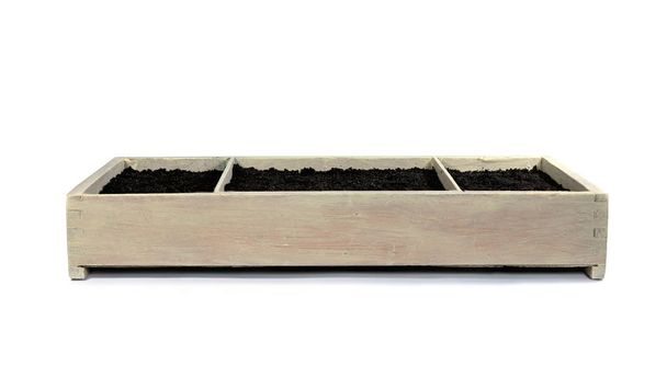 Wooden box with soil for growing plants isolated on white background. Garden box for planting herbs on window sill at home - Foto, Bild