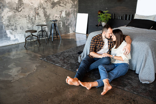 Attractive couple in a loft bedroom at home - Photo, image
