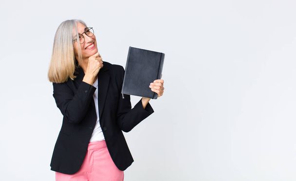 middle age businesswoman with a notebook - Photo, Image