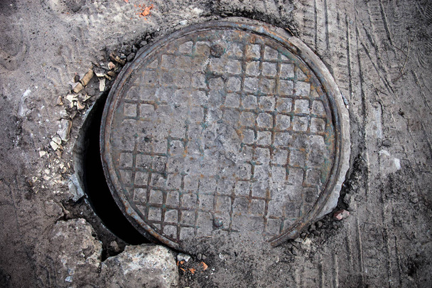 Open manhole with metal cover - Photo, Image