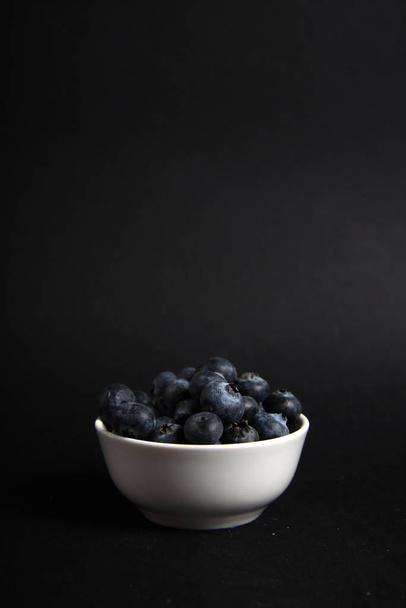 a bowl of blueberry isolated on black background - Photo, Image