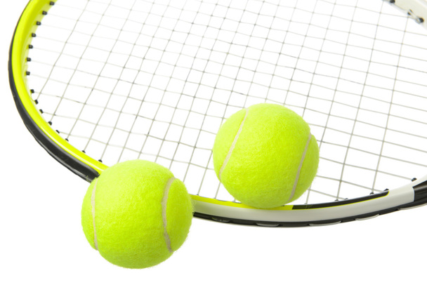 Two tennis balls and racket - Valokuva, kuva