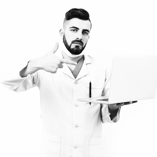 Guy wears surgical mask isolated on white background - Photo, Image