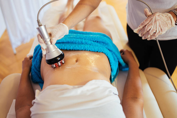 Cavitation RF body treatment and contemporary medicine for health beauty improvement and fat and cellulite removal - Fotó, kép