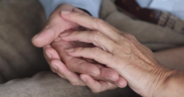 Empathic older family couple stroking hands of each other. - Video, Çekim