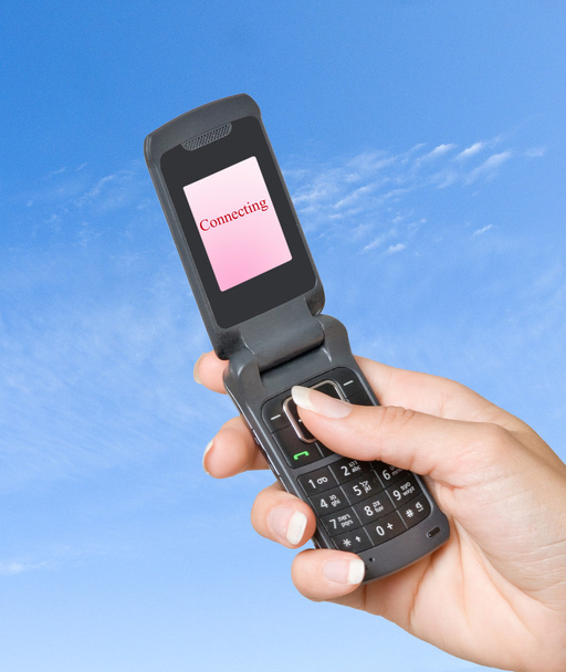 Mobile phone with "Connecting" shown on its screen - Photo, Image