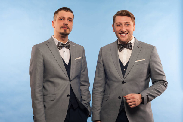 Two handsome positive men in formal clothes - Foto, imagen