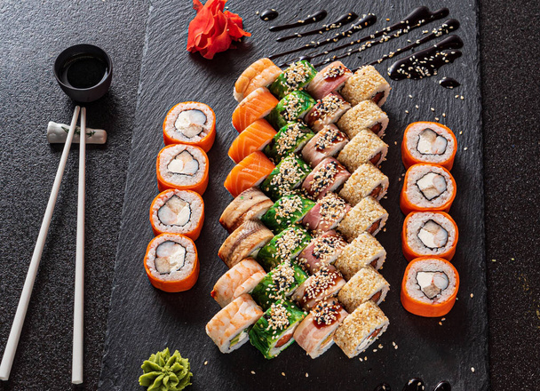 sushi on the black background - Fotó, kép