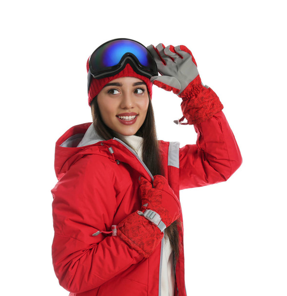 Woman wearing stylish winter sport clothes on white background - Fotó, kép