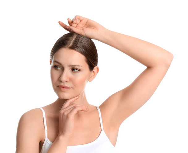 Young beautiful woman showing armpit with smooth clean skin on w - Foto, Imagen