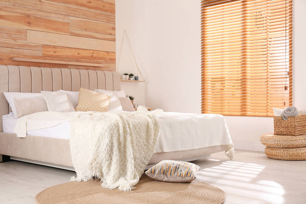 Stylish room interior with big comfortable bed - Photo, Image