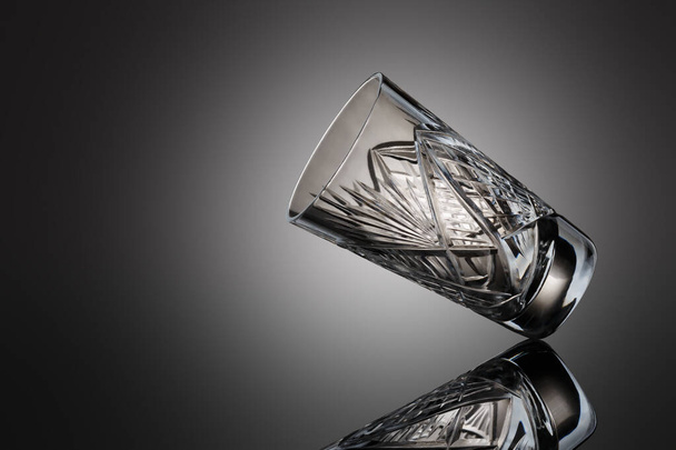 Crystal glass on a gray background - Фото, зображення
