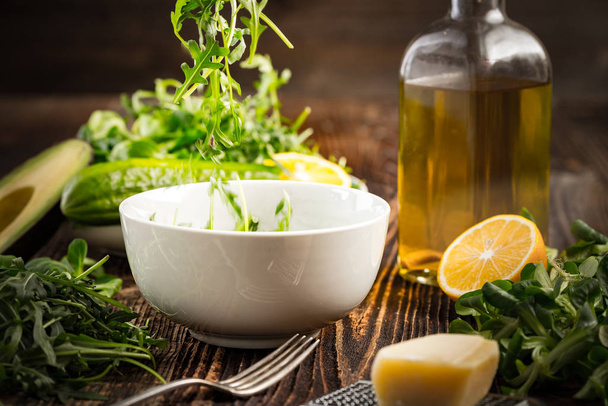 Lettuce and a bottle of olive oil - Fotó, kép