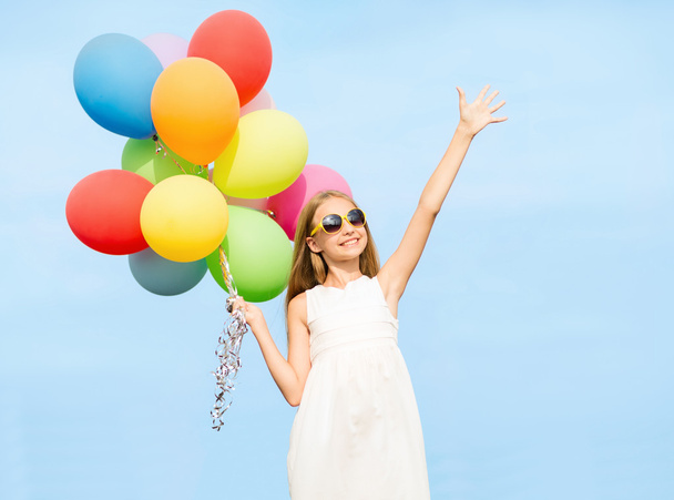 Happy girl with colorful balloons - 写真・画像