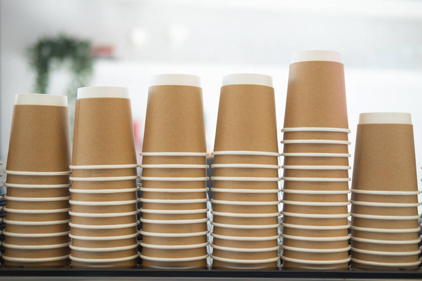 Close up stack of disposable recycling paper cup - 写真・画像