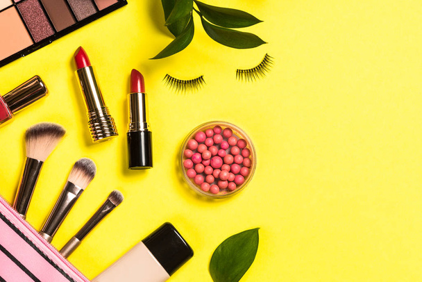 Makeup professional cosmetics on color background. - Photo, Image